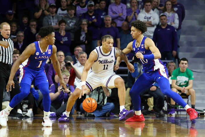 Kansas forward Jalen Wilson defends Kansas State guard Keyontae Johnson